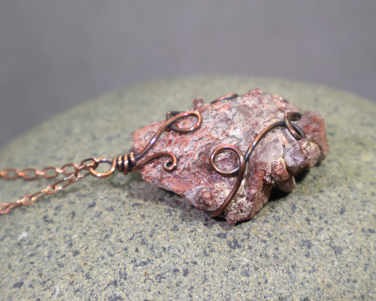 Handmade copper necklace featuring natural red phantom quartz specimen