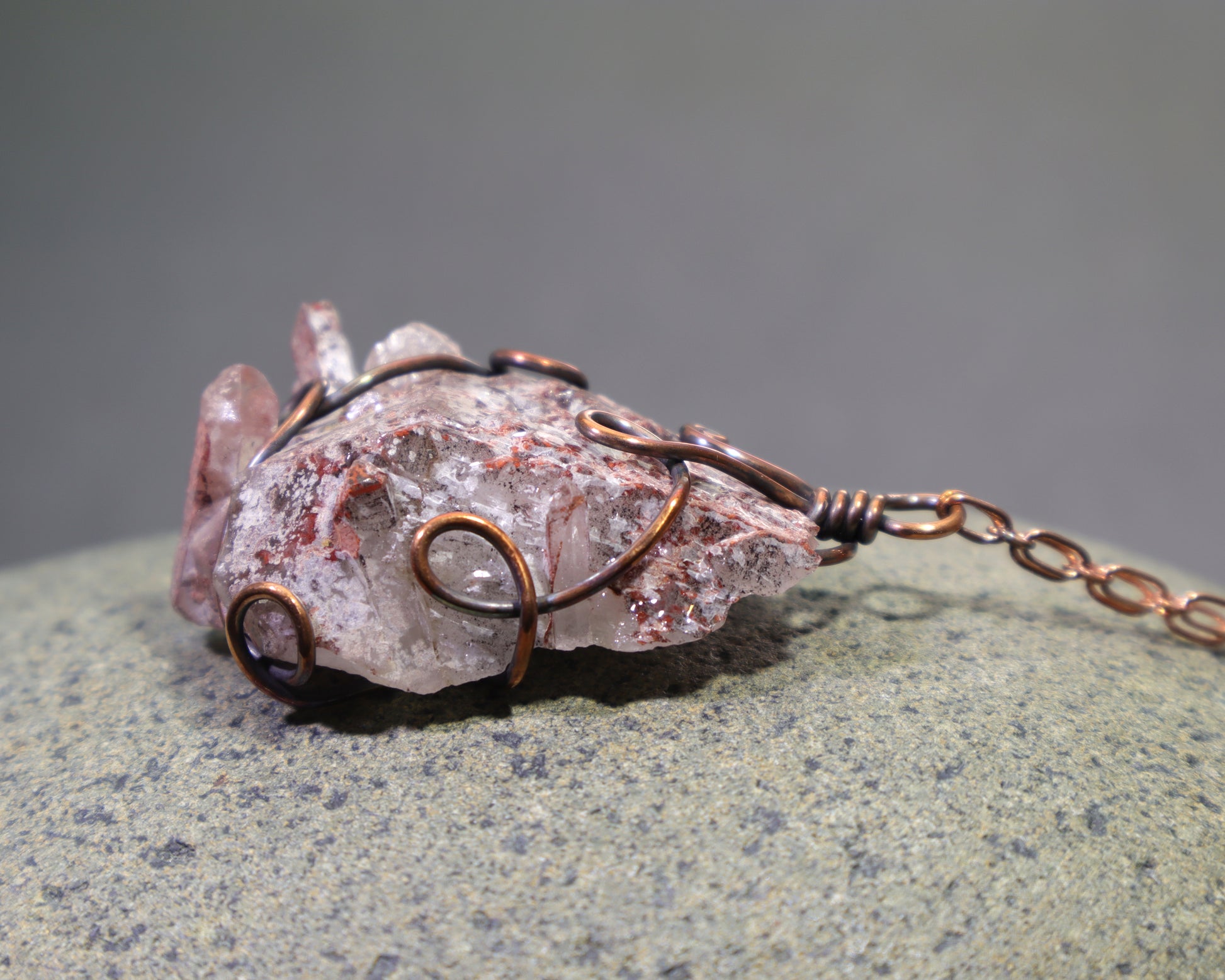 Raw red phantom quartz specimen from Colombia in handmade copper setting