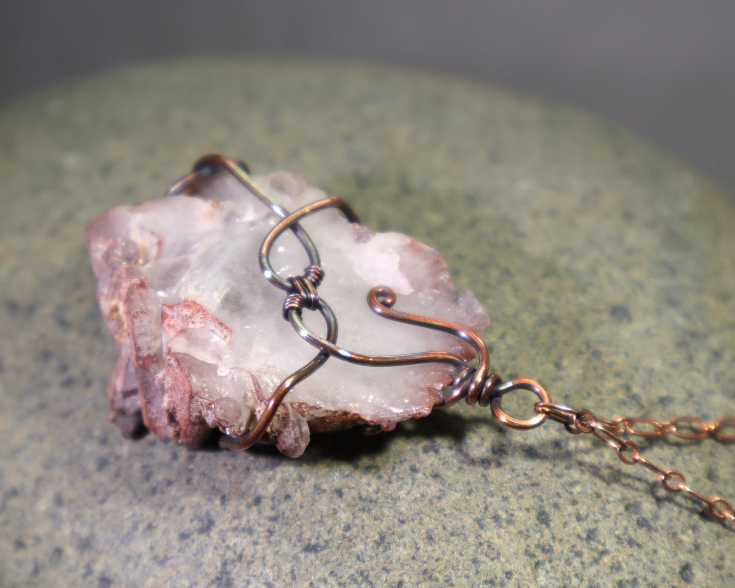 back side of raw crystal cluster necklace with visible phantom quartz formations