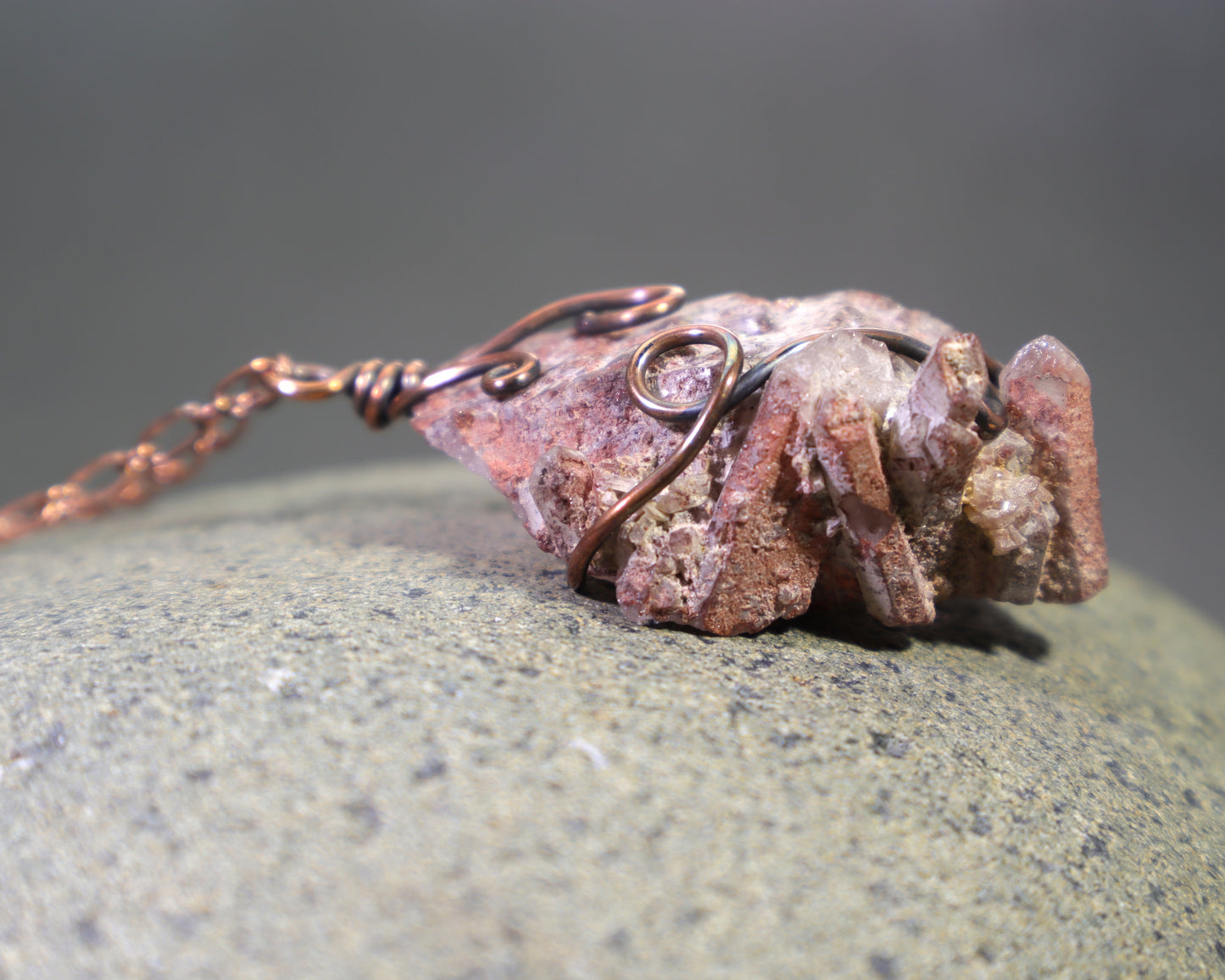 Harlequin quartz crystal necklace featuring red hematite inclusions
