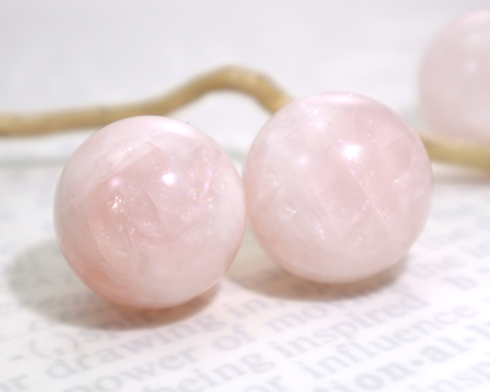 A pair of natural rose quartz spheres 27–29mm polished pink crystal balls