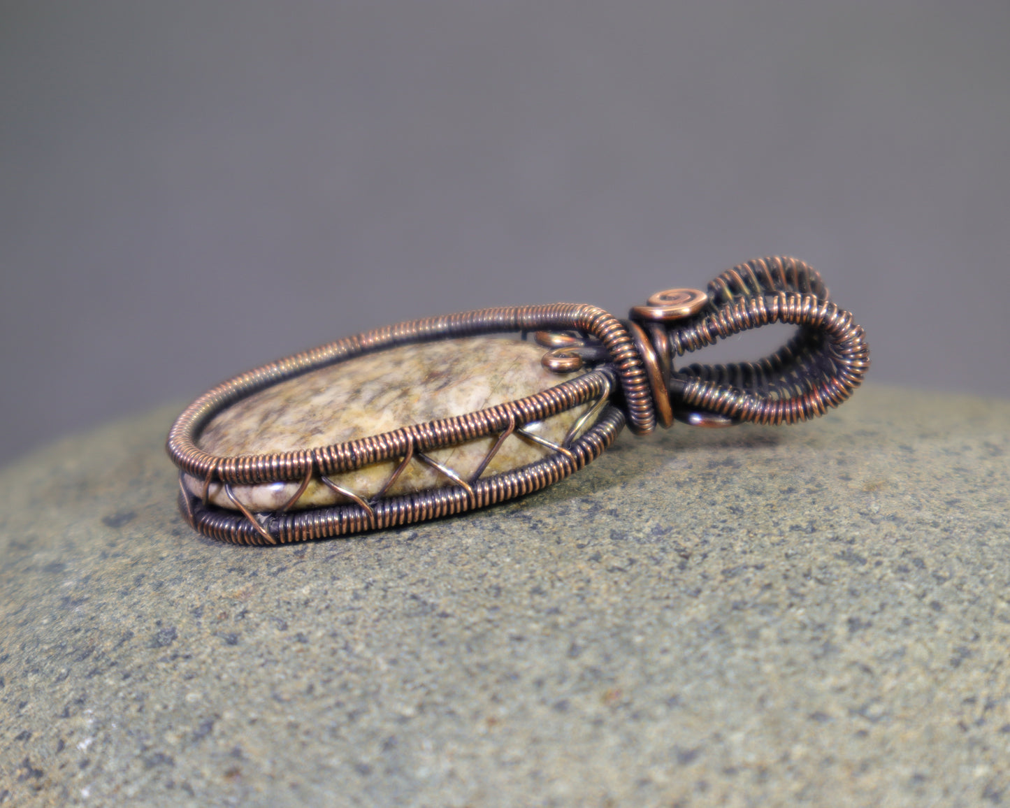 Artisan wire wrapped jasper pendant with warm copper patina
