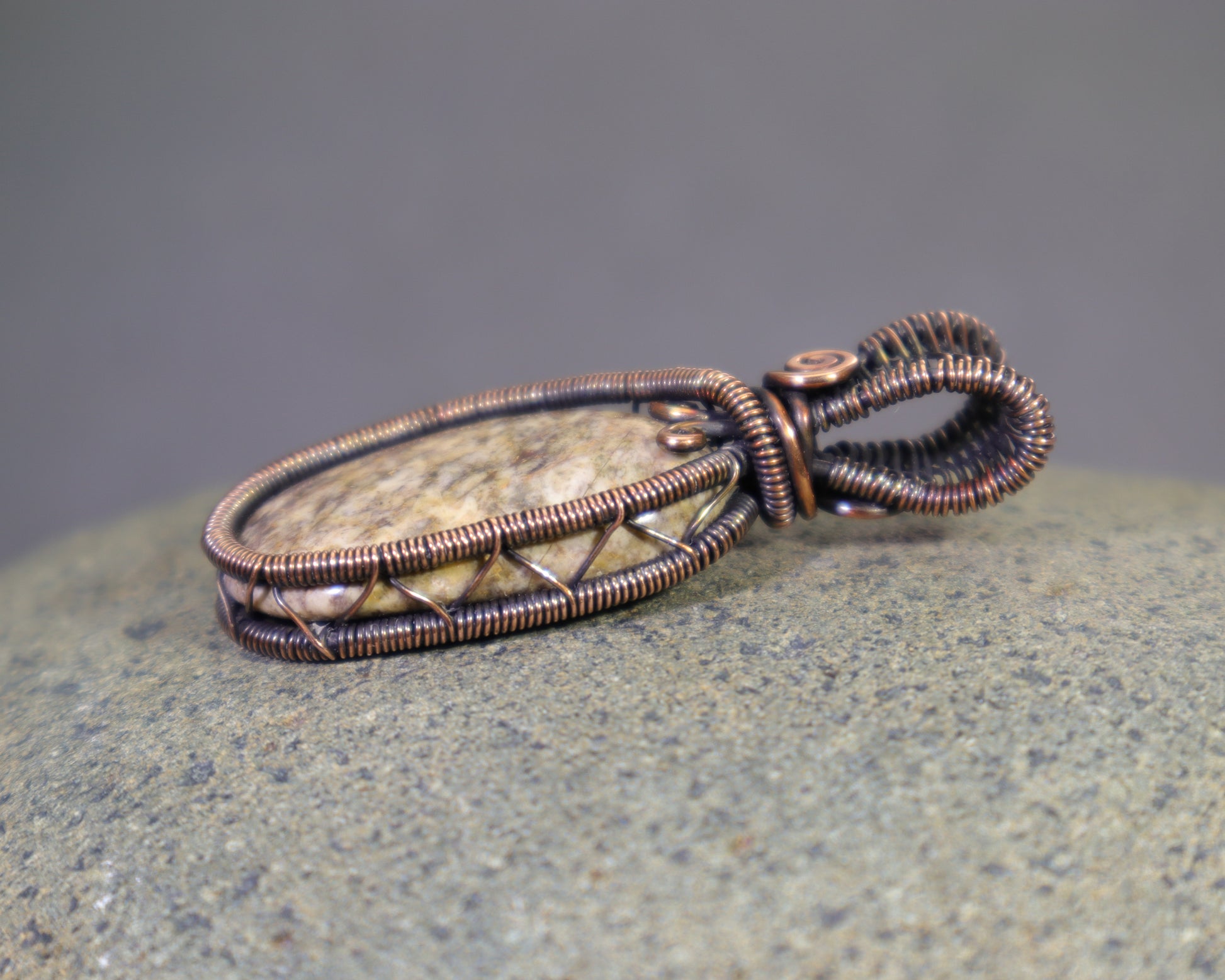 Artisan wire wrapped jasper pendant with warm copper patina
