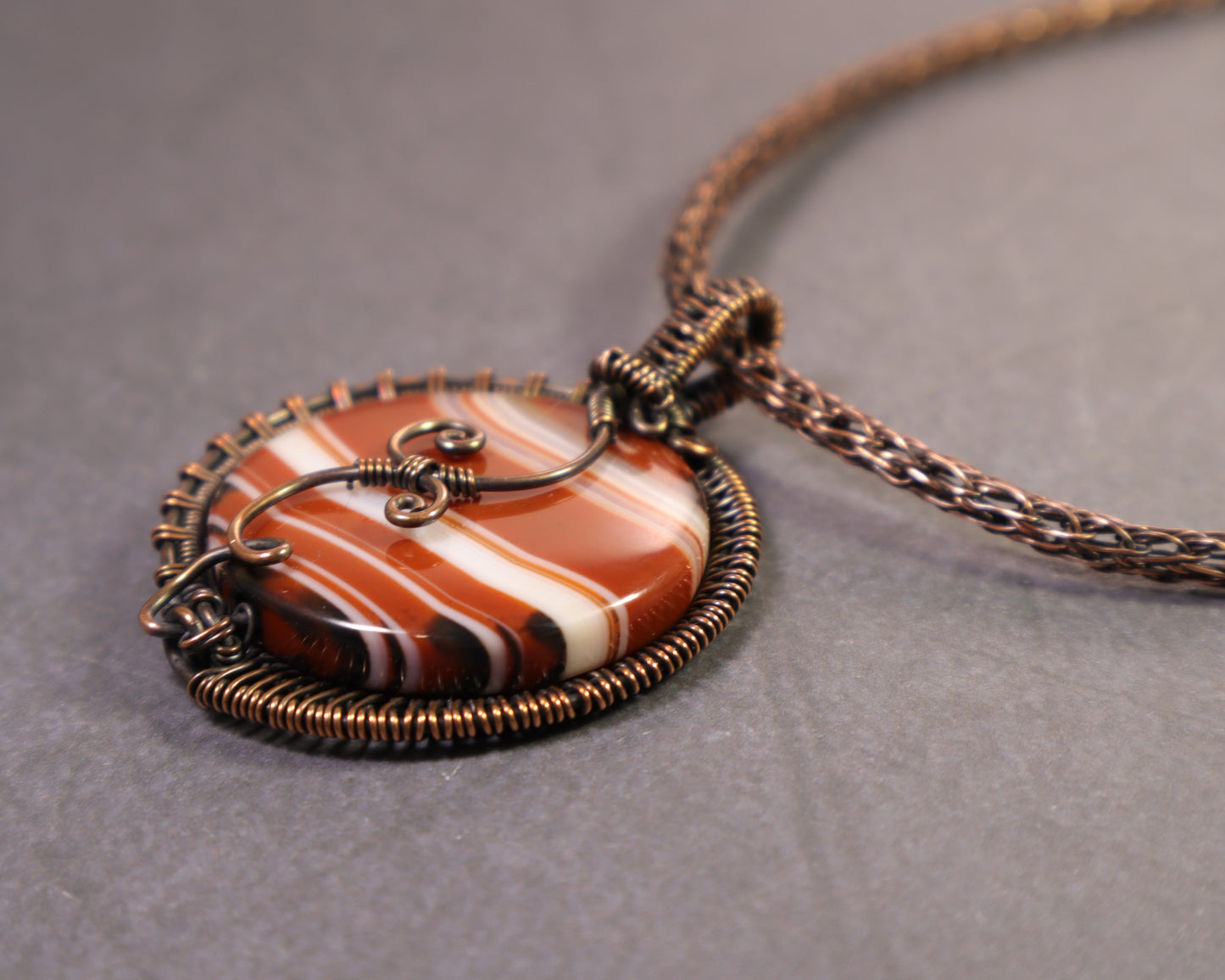 Art Nouveau inspired copper wire wrapped sardonyx gemstone pendant