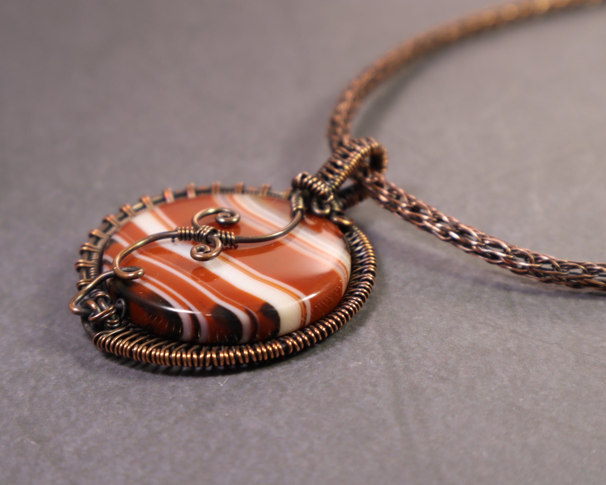 Art Nouveau inspired copper wire wrapped sardonyx gemstone pendant