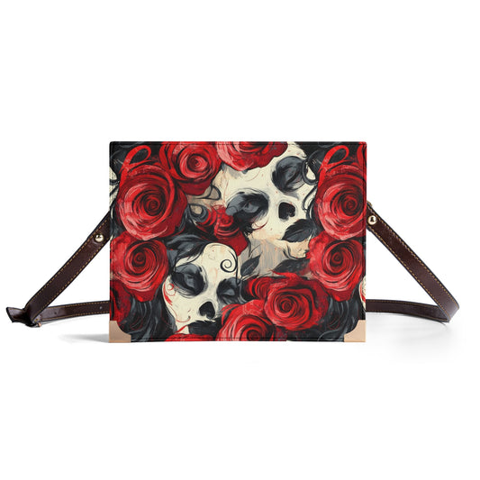 Front view of gothic skull and rose book cover purse with a bold red floral and abstract skull design.