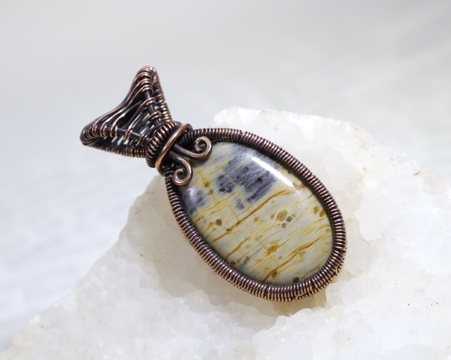 Earth tone jasper pendant featuring cream green and golden patterns