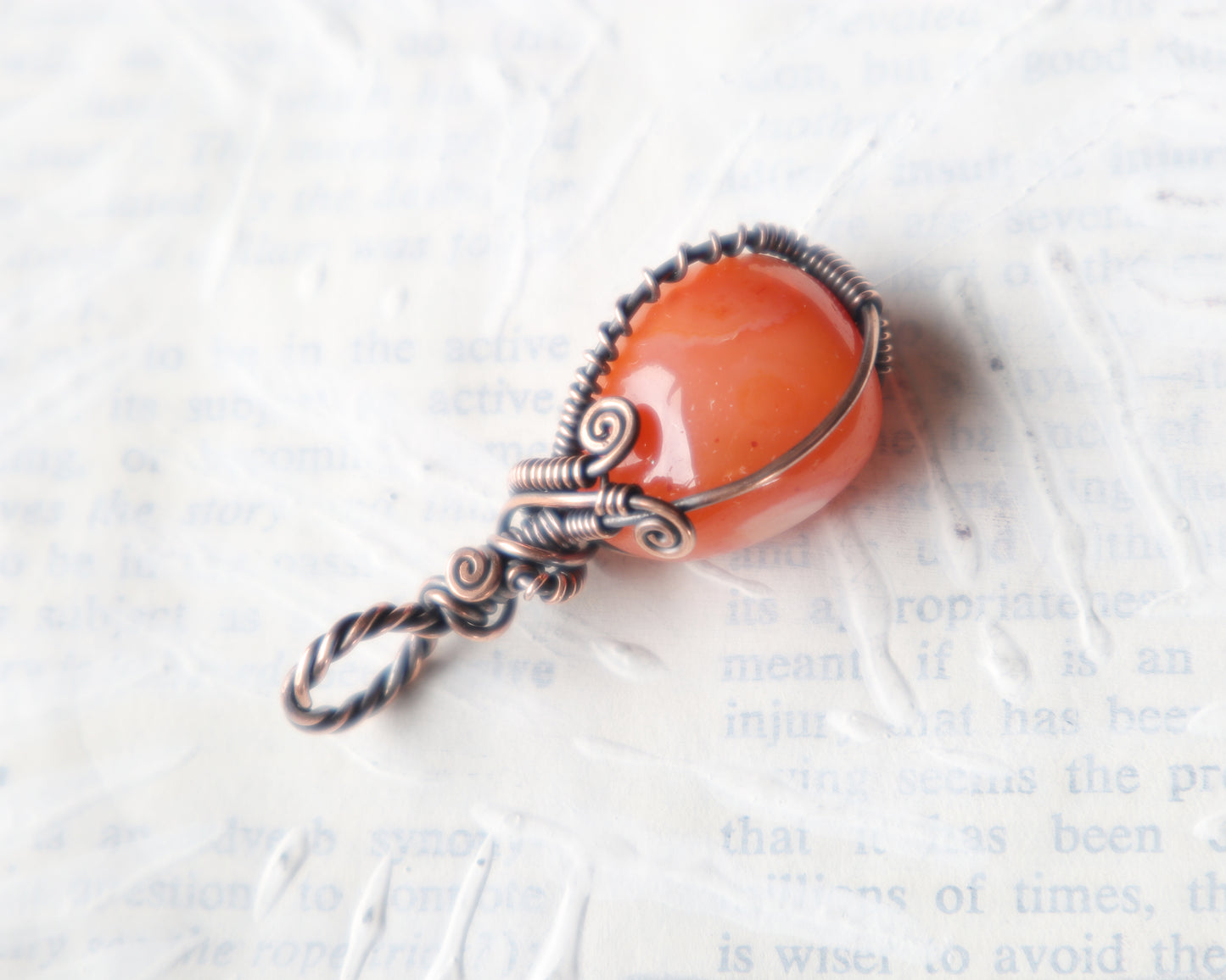 One of a kind carnelian pendant featuring Art Nouveau wire wrapping
